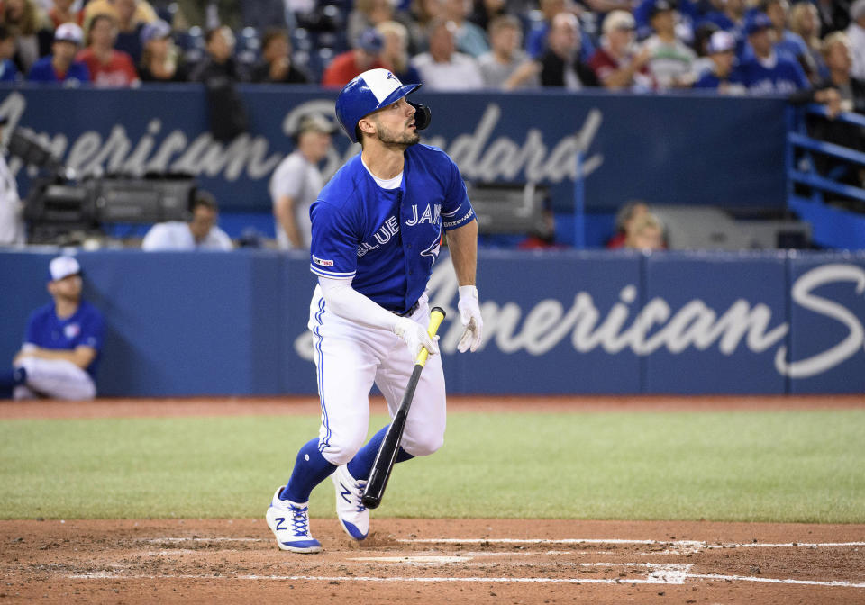 Sep 15, 2019; Toronto, Ontario, CAN; Toronto Blue Jays center fielder Randal Grichuk (15) hits a home run against the New York Yankees during the third inning at Rogers Centre. Mandatory Credit: Nick Turchiaro-USA TODAY Sports