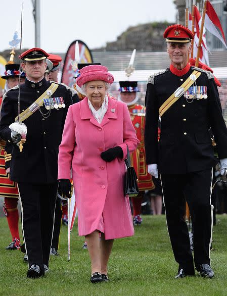 It was the royal meeting we were waiting for! Princess Charlotte Elizabeth Diana met her great-grandmother Queen Elizabeth on her third day of life. The Queen was photographed as she left Kensington Palace after visiting her newborn great-granddaugther. Getty Images On May 2, the day of Charlotte's arrival, Queen Elizabeth wore an all-pink ensemble as she attended the amalgamation parade of the Queen's Royal Lancers and 9th/12th Royal Lancers. The color choice was seen as a way to celebrate the birth of her granddaughter. Getty Images <strong> PHOTOS: Princess Charlottes' First Pics! </strong> It was a big day for Charlotte as the fourth-in-line to the British throne was also registered on Tuesday. Will signed the document as "His Royal Highness Prince William Arthur Philip Louis Duke of Cambridge." Kate Middleton's full name, Catherine Elizabeth, was used for the document as was her enviable occupation: "Princess of the United Kingdom." Getty Images Charlotte weighed in at 8lbs, 3 oz., and Kate was out of the hospital in less than 12 hours after delivery. <strong> NEWS: Kate Middleton's Quick Delivery: Everything You Need to Know About Princess Charlotte's Birth </strong> There's still one family member who has yet to meet the latest addition to the royal family though! Her uncle Prince Harry is currently in a month-long secondment with the Australian Defence Force, but he said, "I can't wait to meet her," in a statement. Meet the newest royal in the video below.