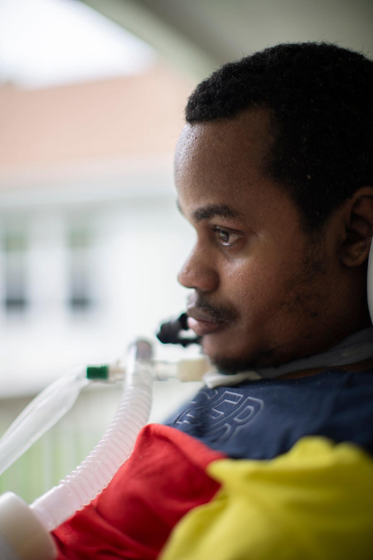 Kassim Omar feels the fresh air on her face for the first time in months one May afternoon in the courtyard of her Far East Side nursing home where she lives. Omar, 29, is paralyzed and, until getting a motorized wheelchair earlier this year, couldn't leave her bed since she was shot in the back of the neck in 2022.