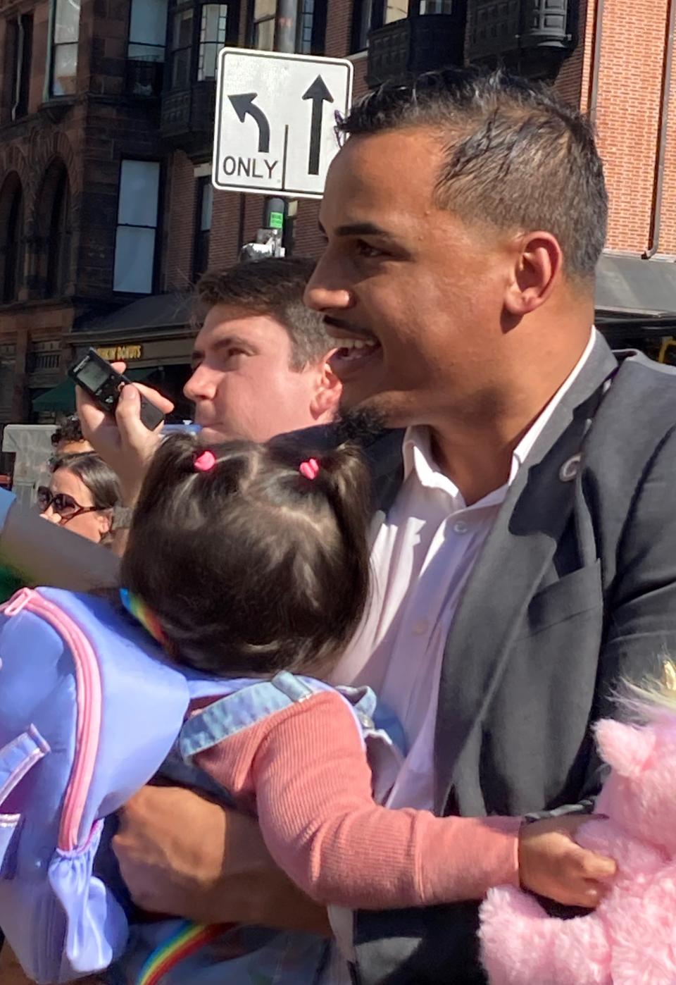 Rep. Manny Cruz, D-Salem, attended the rally Thursday with his daughter Ivy, who was delivered by a midwife, Esther Hausman, of Concord.