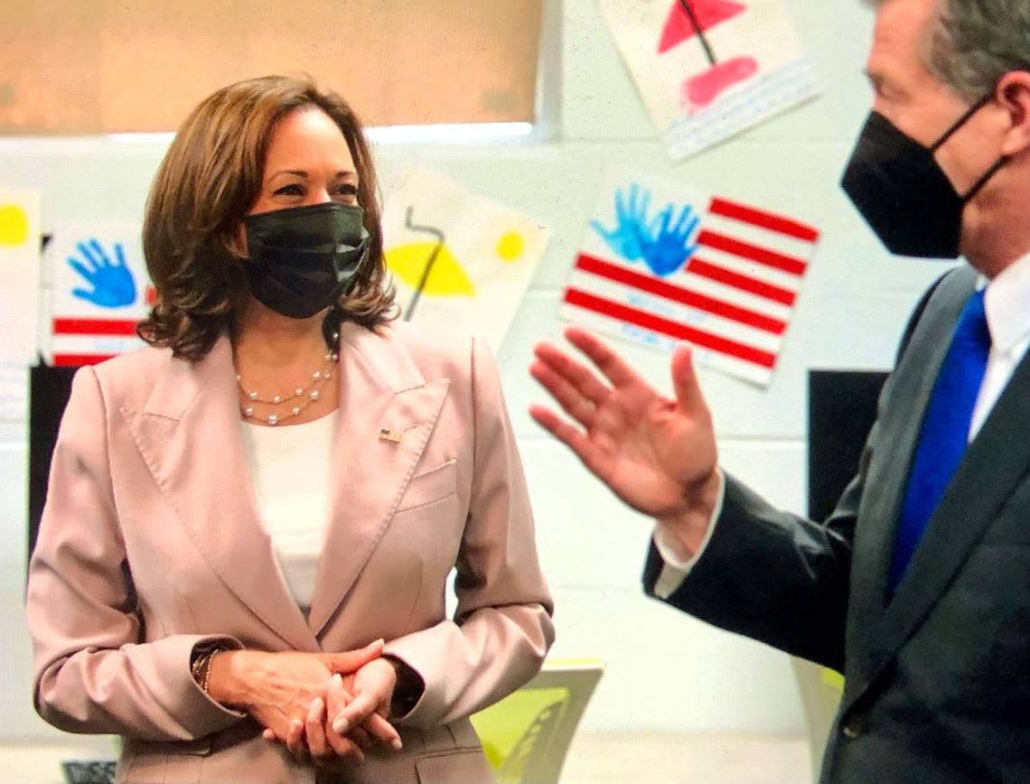 Vice President Kamala Harris listens to North Carolina Governor Roy Cooper during a discussion about ACP, the Affordable Connectivity Program Hoefener Community Services Center on Thursday in Charlotte.