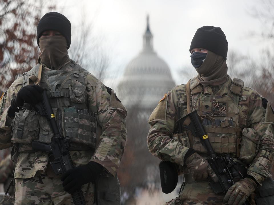 US National Guardsmen stand on a closed street outside the Capitol Building. Some 25,000 National Guard troops have been brought in from across the country to ensure security on Inauguration Day, replacing the huge crowds of tourists that would usually gather in the nation’s capital to welcome a new presidentYegor Aleyev/TASS