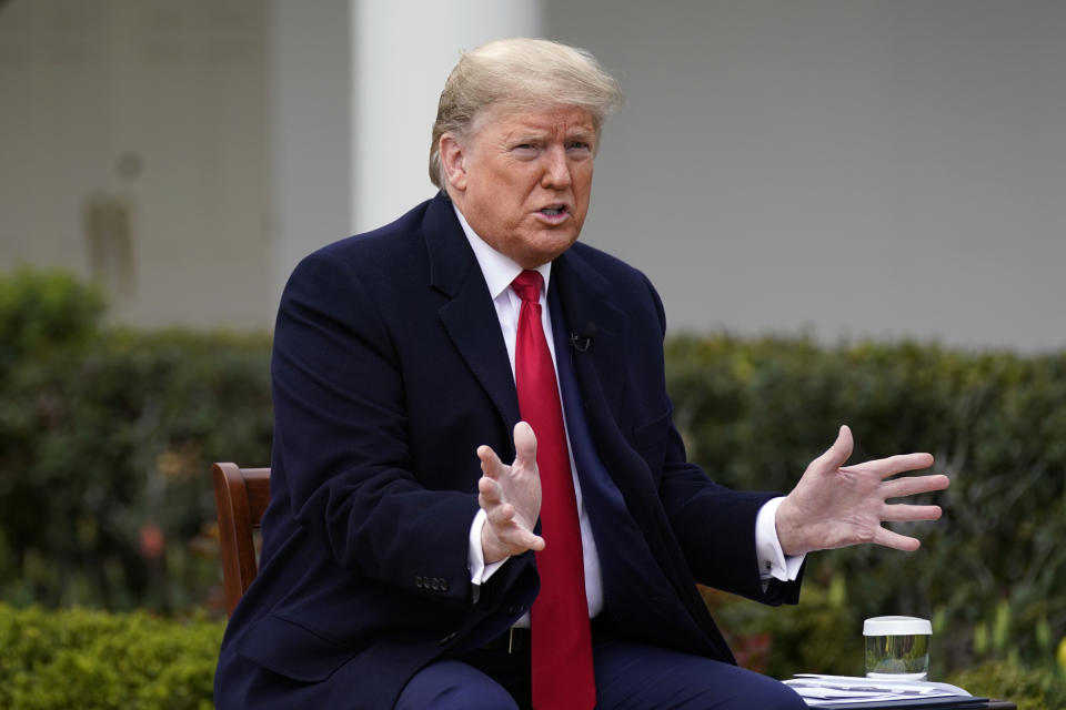 President Donald Trump speaks with Fox News Channel Anchor Bill Hemmer during a Fox News Channel virtual town hall, at the White House, Tuesday, March 24, 2020, in Washington. (AP Photo/Evan Vucci)