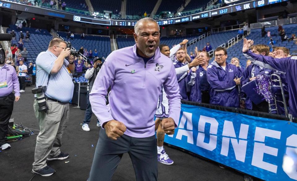 Kansas State Coach Jerome Tang celebrates with the team’s cheerleaders after his team secured a spot in the Sweet 16 with a win over Kentucky in Greensboro, N.C., on Sunday. KSU was picked to finish last in the Big 12 in the preseason.