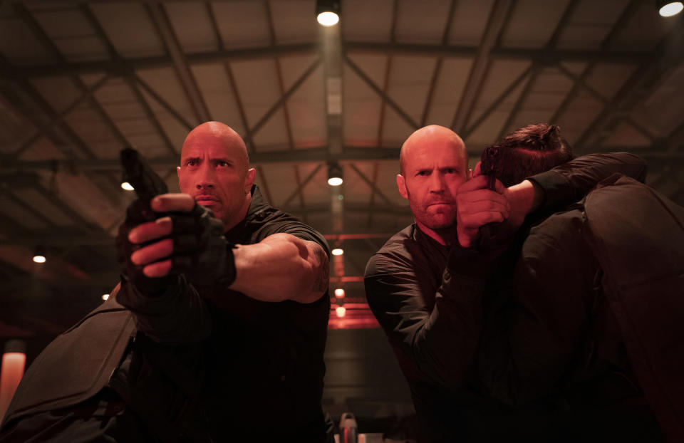 This image released by Universal Pictures shows Dwayne Johnson, left, and Jason Statham in a scene from "Fast & Furious Presents: Hobbs & Shaw." (Daniel Smith/Universal Pictures via AP)