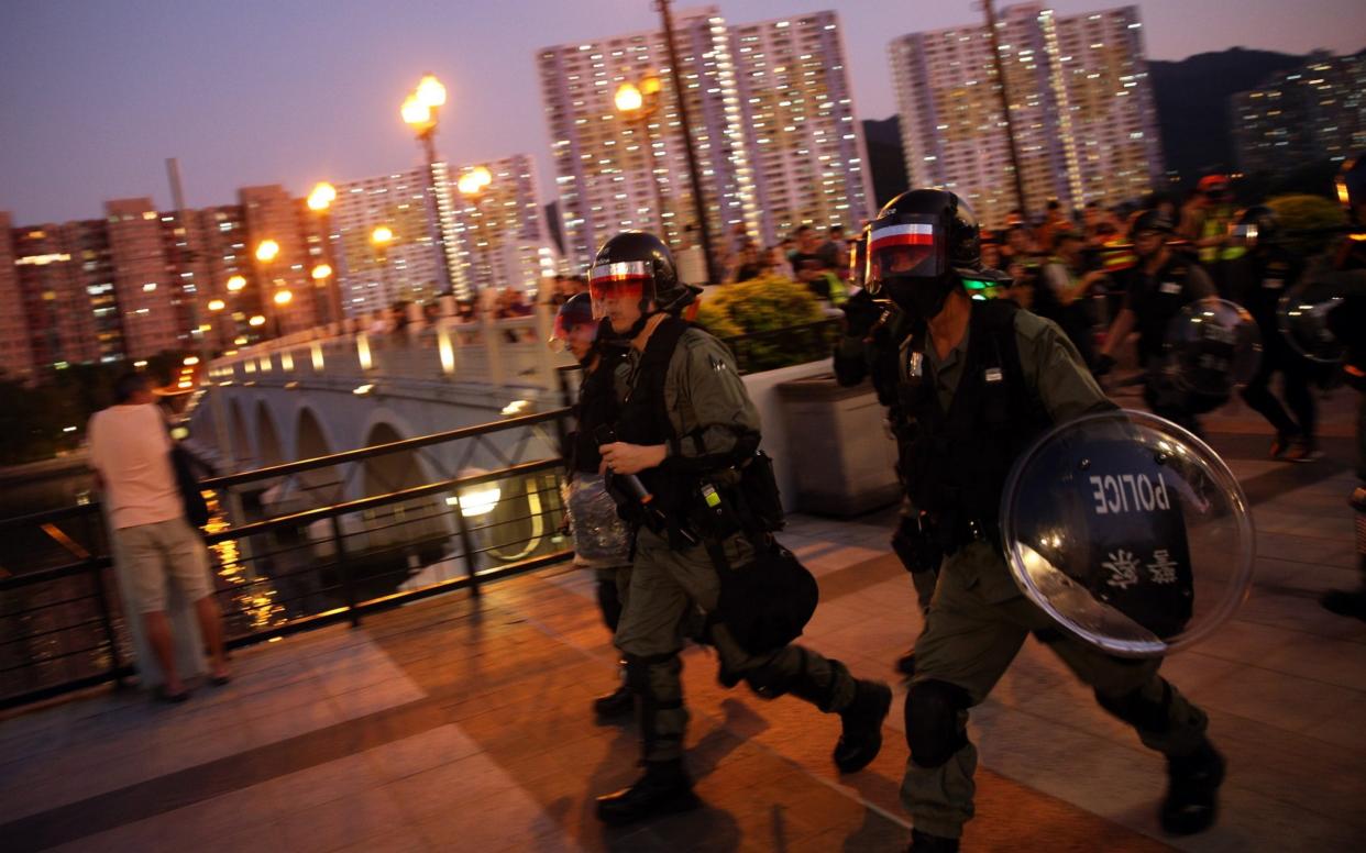 Riot police on the move in Sha Tin in Hong Kong, China - REX