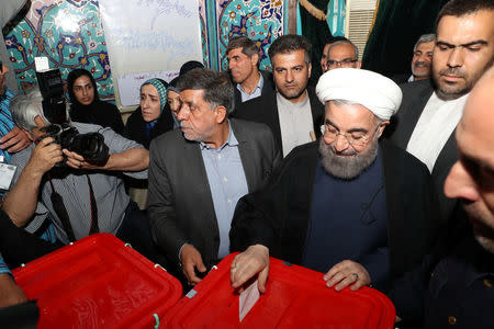 Iran's President Hassan Rouhani casts his ballot during the presidential election in Tehran, Iran, May 19, 2017. President.ir/Handout via REUTERS