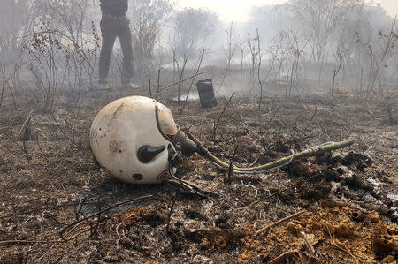 A helmet is seen lying near the site of a crashed Indian Air Force's Mirage 2000 trainer aircraft in the southern city of Bengaluru, India, February 1, 2019. REUTERS/Ismail Shakil