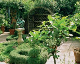 <p> Appealing garden structures and yard art are a hallmark of English garden ideas and help to reinforce the geometrical aspects of the space. They don’t have to be grand. Even if your garden is on the smaller side, you can still add a focal point with a gazebo, pavilion or pergola.  </p> <p> To succeed as a design feature aim to integrate the structure into the rest of the garden so it looks cohesive. Garden shade such as these have a practical use too as a place for relaxing, entertaining or offering a retreat from the sun, as well as providing a framework for flowering climbers such as roses, clematis and vines to scramble over to create that wild romping look that's key to this design aesthetic. </p> <p> If space is tight a simple arbor will add charm and a vital design element that completes the overall look of your English garden. Whether festooned with climbers or left bare, they provide a simple architectural detail that works well. If there really isn’t enough room for any of these options, an English-inspired whimsical dovecote will work just as well as a real conversation piece. </p>