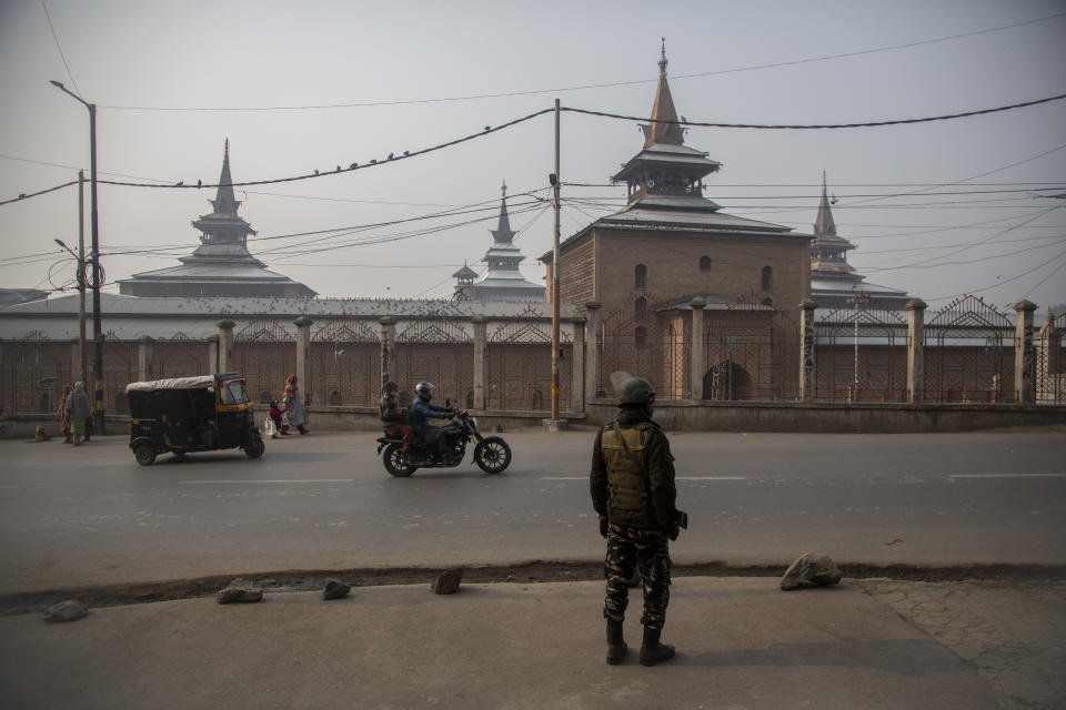 An Indian paramilitary soldier guards outside the Jamia Masjid, or the grand mosque in Srinagar, Indian controlled Kashmir, Nov. 26, 2021. The mosque has remained out of bounds to worshippers for prayers on Friday – the main day of worship in Islam. Indian authorities see it as a trouble spot, a nerve center for anti-India protests and clashes that challenge New Delhi’s sovereignty over disputed Kashmir. For Kashmiri Muslims it is a symbol of faith, a sacred place where they offer not just mandatory Friday prayers but also raise their voice for political rights. (AP Photo/Mukhtar Khan)