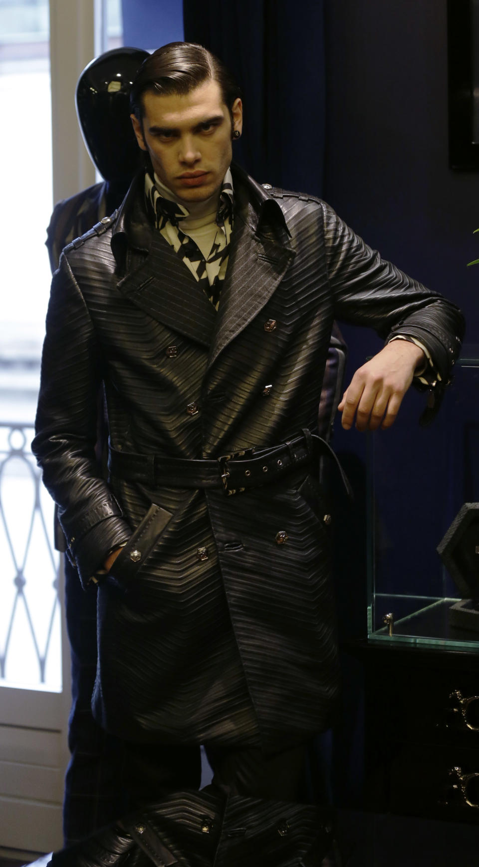 A model wears a creation for Angelo Galasso men's Fall-Winter 2013-14 collection, part of the Milan Fashion Week, unveiled in Milan, Italy, Sunday, Jan. 13, 2013. (AP Photo/Luca Bruno)