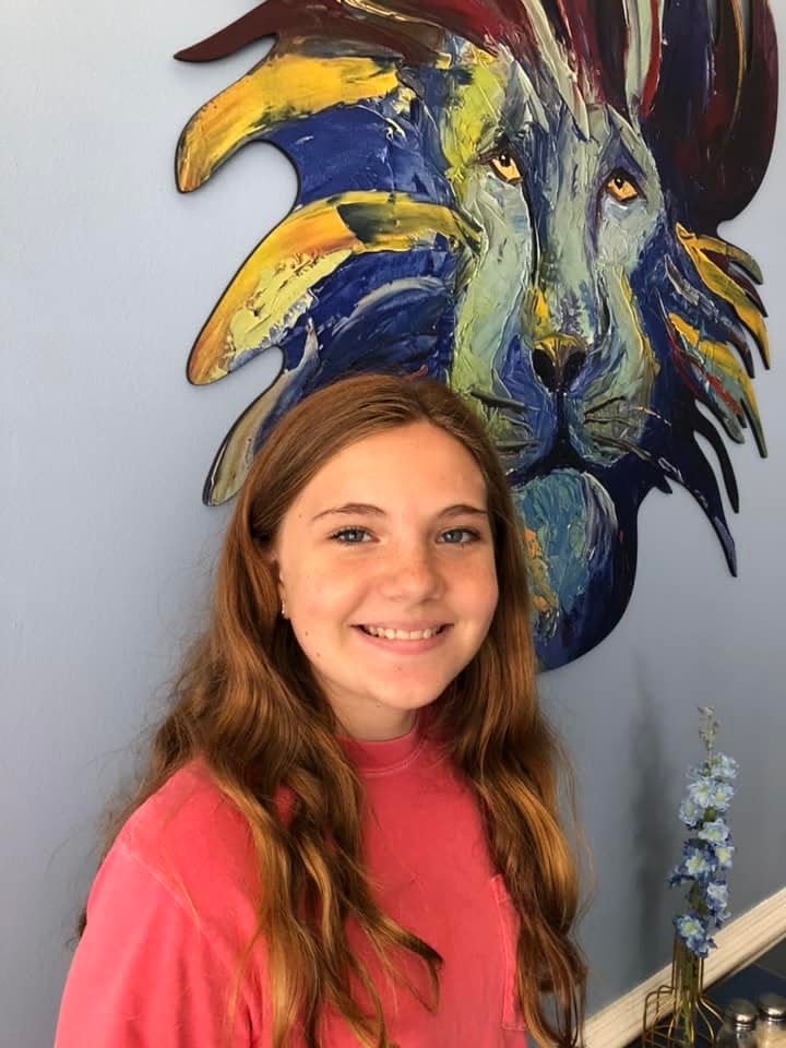 Eleven-year-old Lila McCoy of Dinwiddie strikes a pose at The Hangry Lion restaurant in Petersburg on Friday, Sept. 1.