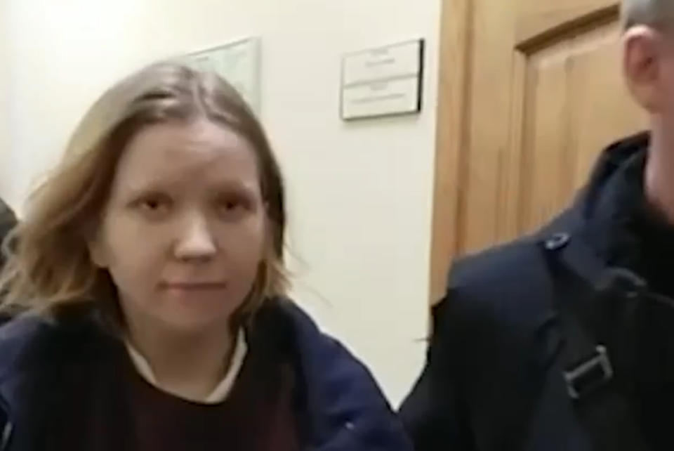 This image taken from video released by the Russian Investigative Committee on Monday, April 3, 2023, shows Darya Trepova, a 26-year-old St. Petersburg resident suspected of involvement in a bombing at a St. Petersburg cafe walking escorted by officers.Anti-Terrorist Committee said Monday that the attack on Vladlen Tatarsky was "planned by Ukrainian special services." Russia's Investigative Committee reported the arrest of Darya Trepova, a St. Petersburg resident suspected of involvement in the attack. (Russian Investigative Committee via AP)