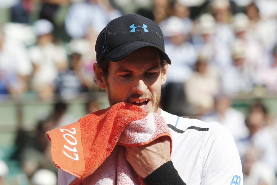 Britain's Andy Murray wipes his face as he plays Switzerland's Stan Wawrinka during their semifinal match of the French Open