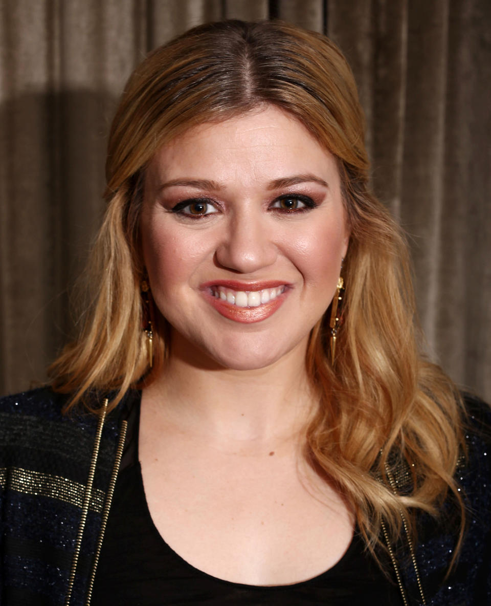 In this Monday, Nov. 5, 2012 photo, musician Kelly Clarkson poses for a portrait in Los Angeles. Clarkson's newest album, "Greatest Hits: Chapter One," is releasing on Monday, Nov. 19, 2012. (Photo by Matt Sayles/Invision/AP)