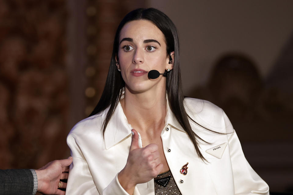 Indiana Fever's Caitlin Clark reacts during an interview during the WNBA basketball draft Monday, April 15, 2024, in New York. (AP Photo/Adam Hunger)