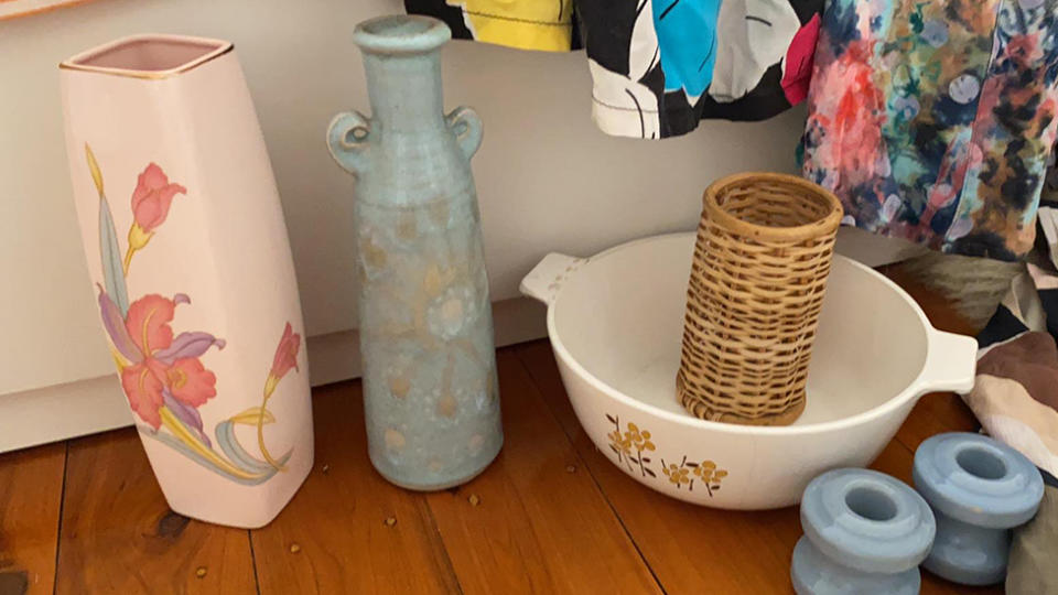 A pink Japanese vase, a blue organic ceramic vase, a white baking dish and a rattan pencil holder