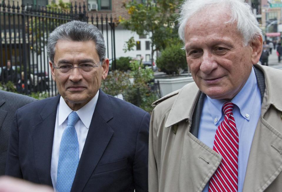 Former Goldman Sachs and Procter & Gamble Co. board member Rajat Gupta, center, arrives outside federal court in New York Wednesday, Oct. 24, 2012. Gupta is to be sentenced after being found guilty insider trading by passing secrets between March 2007 and January 2009 to a billionaire hedge fund founder who used the information to make millions of dollars. At right is Gupta's attorney Gary Naftalis. (AP Photo/Craig Ruttle)
