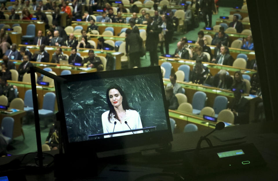 A studio monitor broadcast live Angelina Jolie, United Nations High Commissioner for Refugees special envoy, as she address a meeting on U.N. peacekeeping at U.N. headquarters, Friday, March 29, 2019. (AP Photo/Bebeto Matthews)