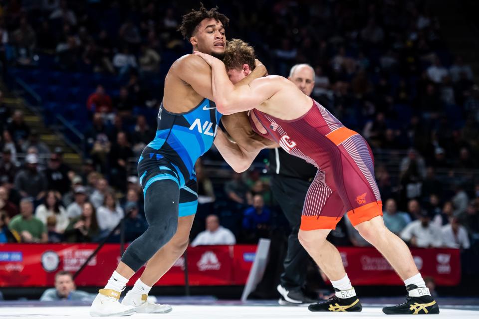 Carter Starocci (left) wrestles Trent Hidlay in a 86 kilogram challenge round quarterfinal bout during the U.S. Olympic Team Trials at the Bryce Jordan Center April 19, 2024, in State College. Hidlay won by decision, 6-4.