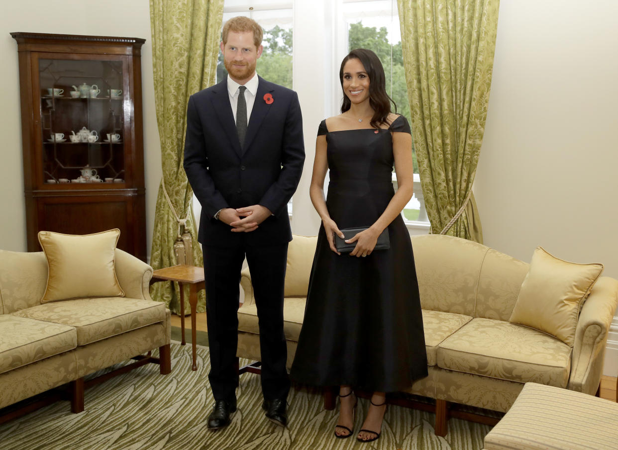 Prince Harry and Meghan Markle, who wore a custom Gabriela Hearst dress, at a reception on their first night in New Zealand. (Photo: Getty Images)