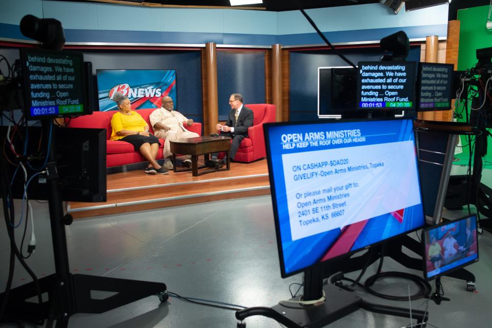Various monitors display teleprompter text and live feed information during WIBW-TV's 4 p.m. newscast as Ralph Hipp, right, talks to his guests on the red couch — Jeanette Mitchell, left, and Samuel Mitchell.