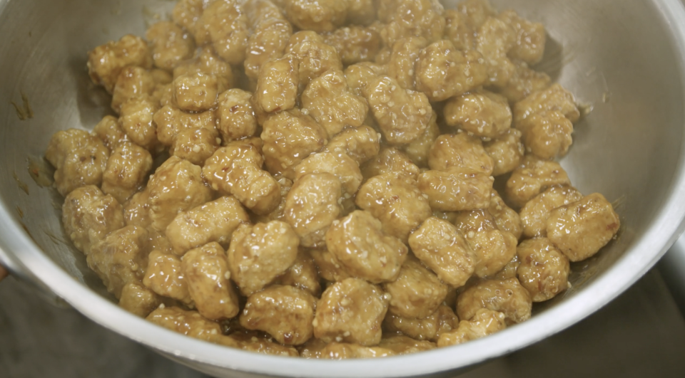 A pan of plant-based orange chicken