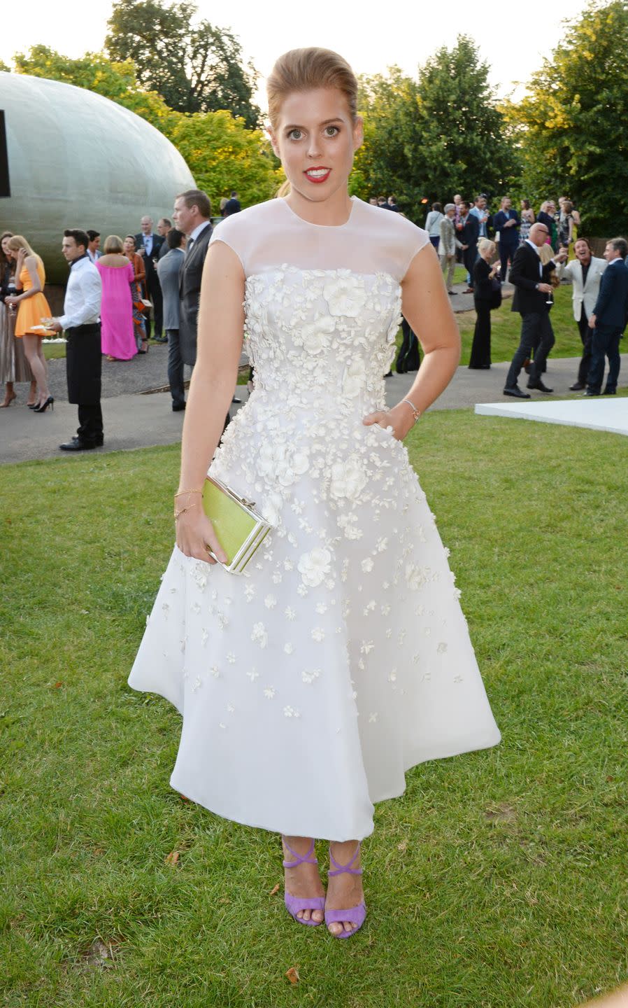 <p>Princess Beatrice attended the Serpentine Gallery Summer Party in 2014 wearing this embellished white dress with a sheer crewneck upper. </p>