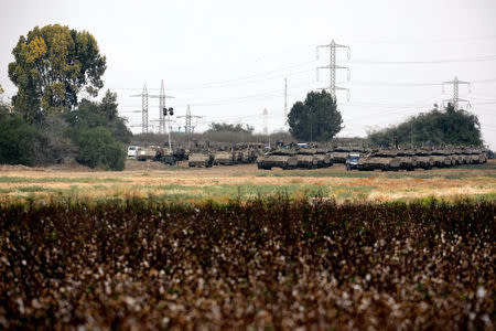 Armoured Israeli military vehicles are seen gathered in an open area near Israel's border with Gaza Strip October 18, 2018. REUTERS/Amir Cohen