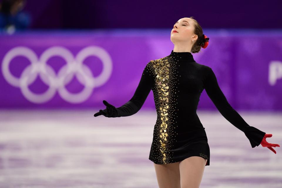 As far as figure skating costumes go, the Ukrainian athlete's is quite conservative. But that's what we love about it -- it's classy and dramatic (but not over-the-top), and the red glove is a&nbsp;nice touch.