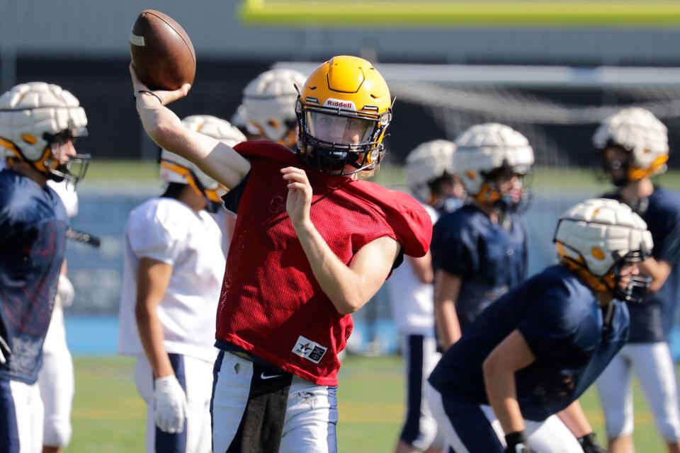 St. Mary Catholic quarterback Garrett Weninger passes the ball during practice Tuesday in Fox Crossing. The Zephyrs return to 11-player football this season.