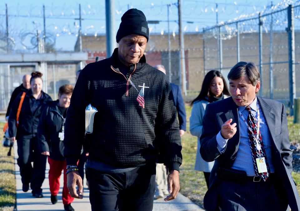 Darryl Strawberry and Mark Vernarelli, a spokesman for the Maryland Department of Public Safety and Correctional Services, walk Wednesday morning with other department officials through security checkpoints on their way into the Maryland Correctional Institution-Hagerstown, where Strawberry would minister to about 80 inmates.