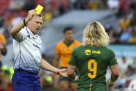 Referee Matthew Carley shows a yellow card to South Africa's Faf de Klerk during the Rugby Championship test match between the Springboks and the Wallabies in Brisbane, Australia, Saturday, Sept. 18, 2021. (AP Photo/Tertius Pickard)