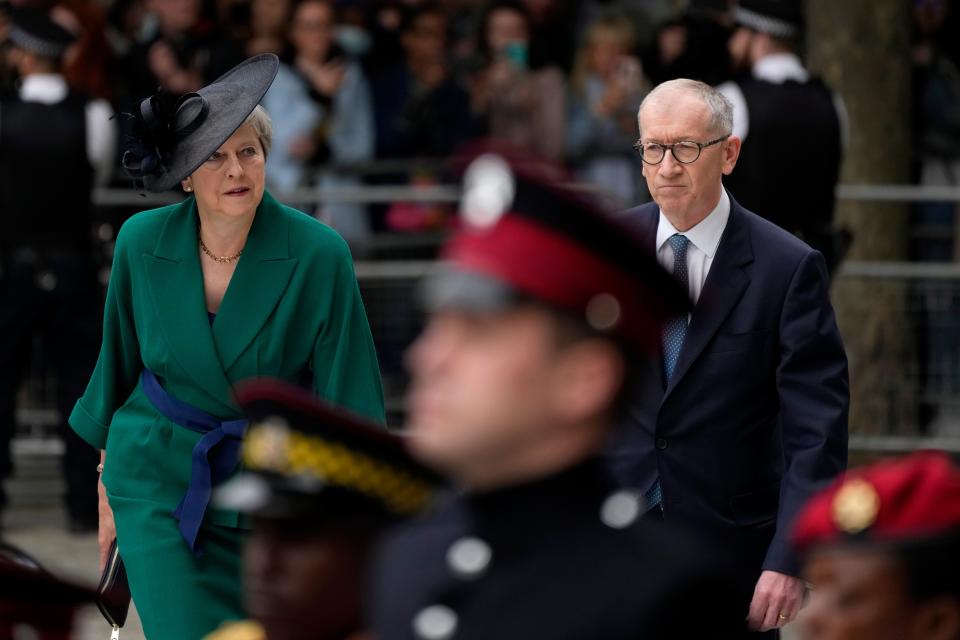 Theresa May and her husband Philip May arrive for a service of thanksgiving (AP)