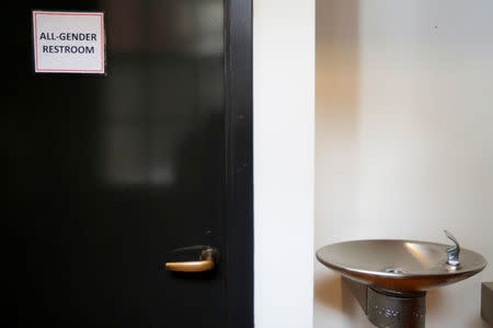 A sign marks an "All-Gender Restroom" at the Radcliffe Institute for Advanced Study at Harvard University in Cambridge, Massachusetts, U.S. May 13, 2016. REUTERS/Brian Snyder