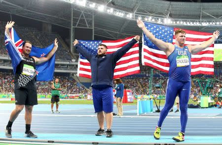 2016 Rio Olympics - Athletics - Final - Men's Shot Put Final - Olympic Stadium - Rio de Janeiro, Brazil - 18/08/2016. Tomas Walsh (NZL) of New Zealand, Joe Kovacs (USA) of USA and Ryan Crouser (USA) of USA celebrate. REUTERS/Alessandro Bianchi