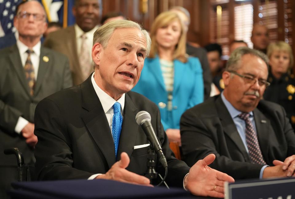 Gov. Greg Abbott answers reporters’ questions about property tax relief bills during an unrelated bill-signing ceremony at the Capitol on Tuesday.