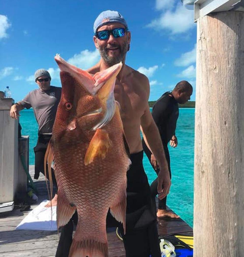 The country star loves to show off the fish that he catches. 