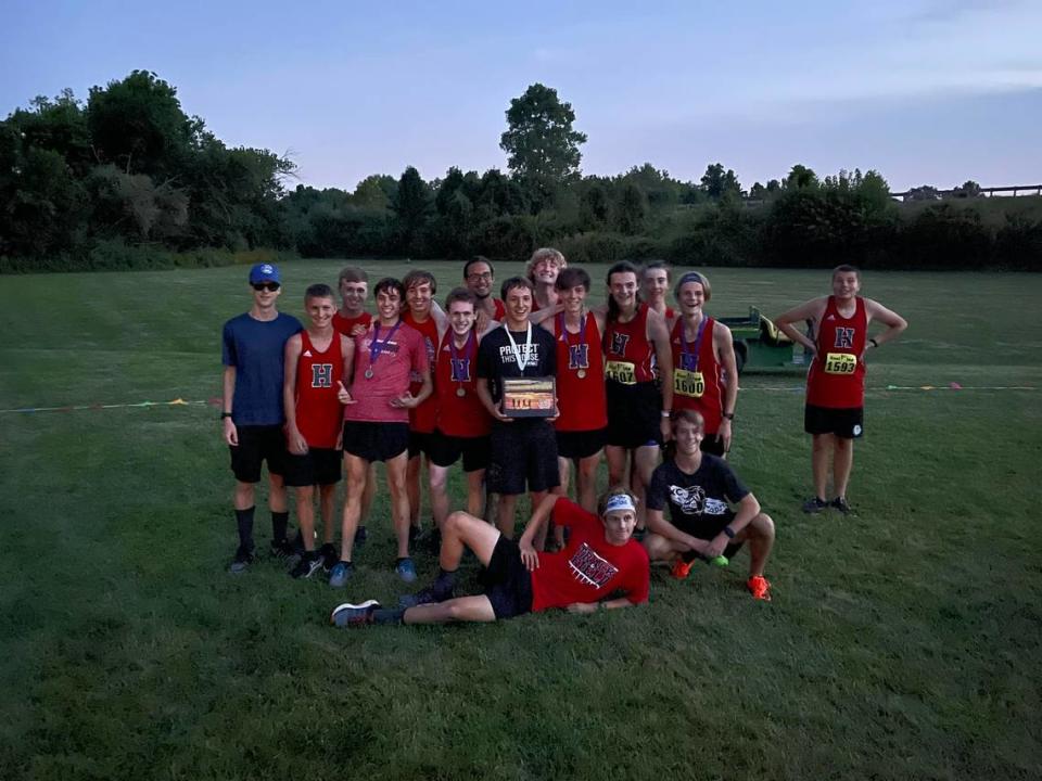 The Highland High School boys cross country team is pictured with their first place trophy after winning the Twilight Invitational hosted by Civic Memorial at the Bethalto Sports Complex earlier this season. In more recent action, HHS took eight place at the Springfield High School Invite meet.