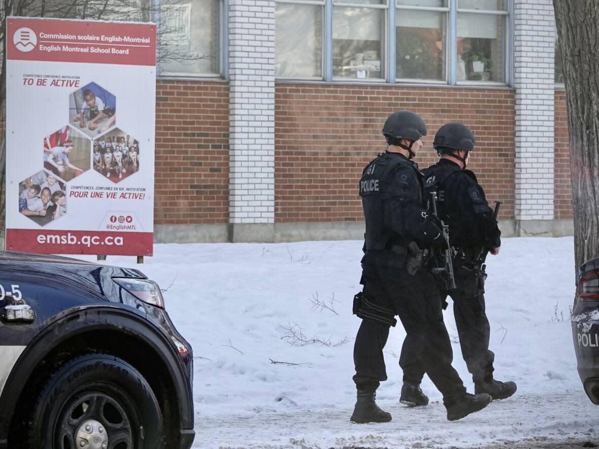 Montreal police deployed a large number of officers to the scene following the stabbing of an art teacher at John F. Kennedy High School last December.  (Simon-Marc Charron/Radio-Canada - image credit)