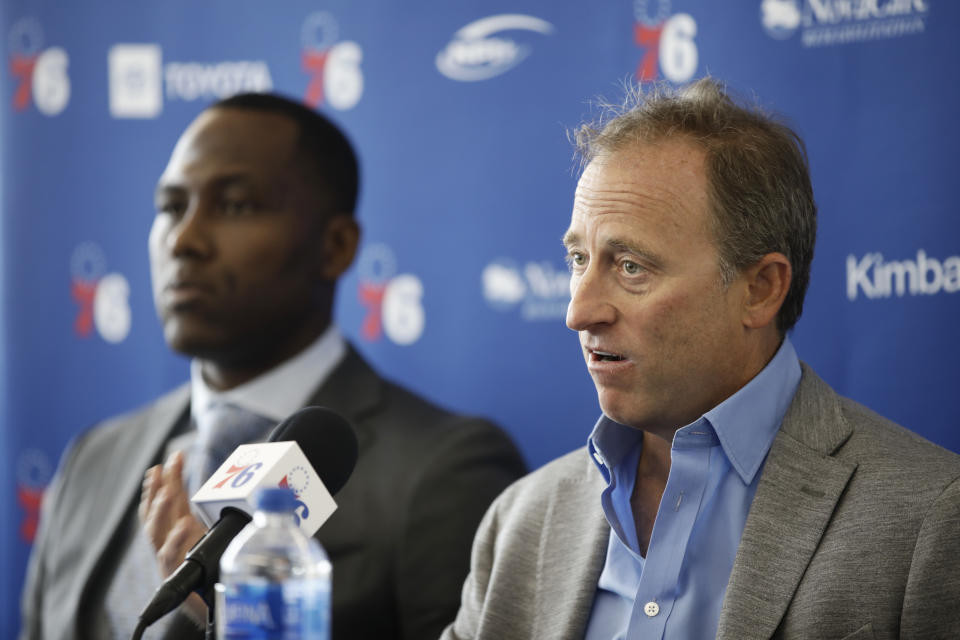 Philadelphia 76ers incoming general manager Elton Brand, left, listens to owner Josh Harris speak at the NBA basketball team's practice facility in Camden, N.J., Thursday, Sept. 20, 2018. (AP Photo/Matt Rourke)