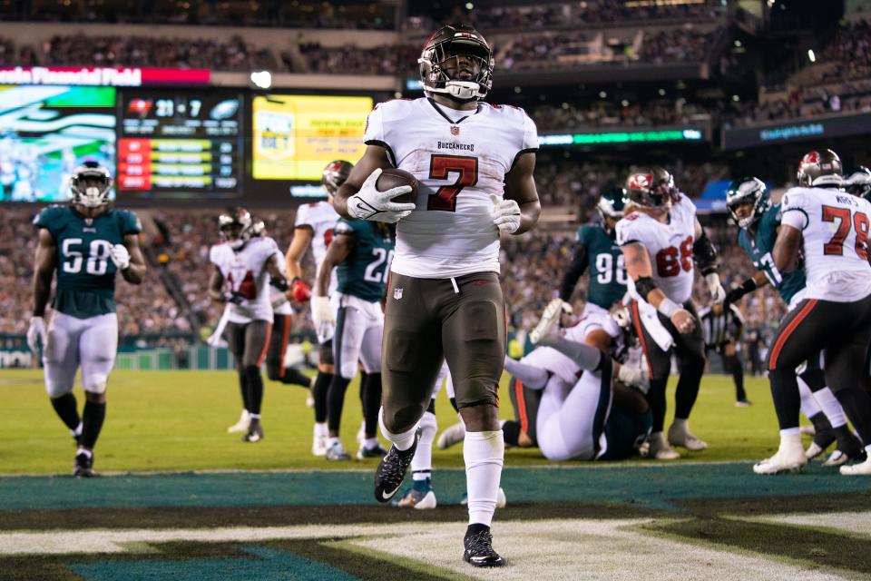 Buccaneers running back Leonard Fournette runs into the end zone untouched in Thursday's game against the Eagles.