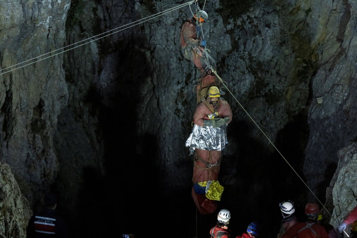 US caver Mark Dickey, on a stretcher, is carried out of the Morca cave as his rescue operation comes to a successful end near Anamur in Mersin province, southern Turkey September 12, 2023 (REUTERS)