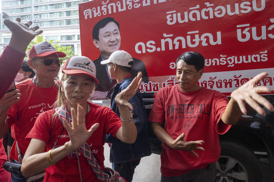 Pheu Thai supporters react, after Thailand's parliament voted in favour of Pheu Thai candidate Srettha Thavisin's prime ministerial candidacy, in Bangkok, Thailand, Tuesday, Aug. 22, 2023. Thavisin from the populist Pheu Thai party secured enough votes in parliament to become the country’s 30th prime minister Tuesday, hours after former Prime Minister Thaksin Shinawatra returned from years of self-imposed exile and began an eight-year prison sentence. (AP Photo/Wason Wanichakorn)