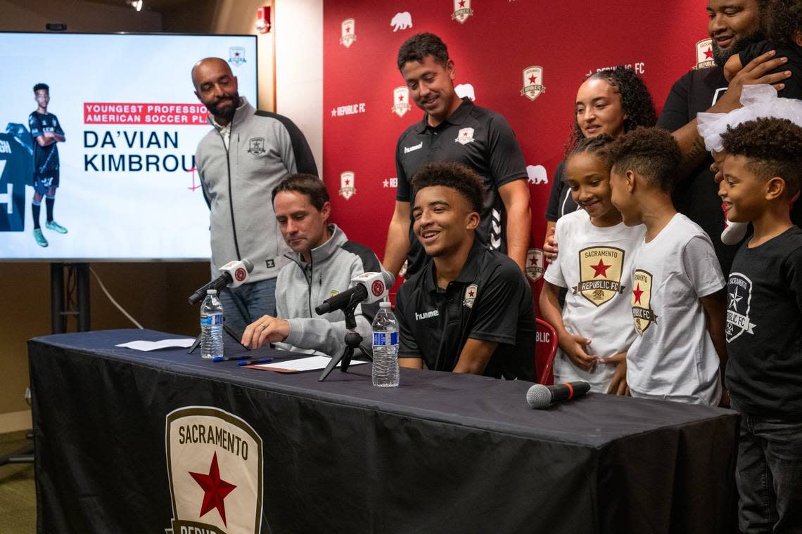 13-year old soccer phenom Da’vian Kimbrough is surrounded by his family and Sacramento Republic FC management after signing a contract Aug. 8 making him the youngest professional athlete in American sports history. Paul Kitagaki Jr./pkitagaki@sacbee.com