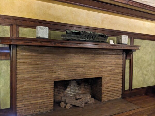 Volcanic rock oya blocks and a copper cornice from the Imperial Hotel rest on the mantel at the Martin House in Buffalo, New York. The display is part of 