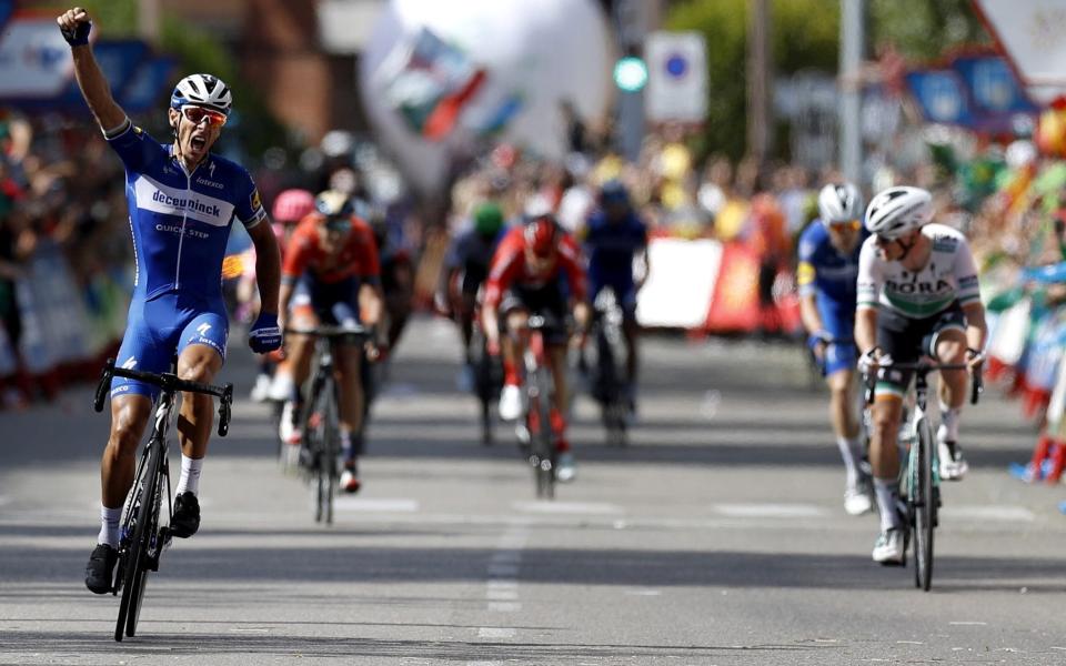 Philippe Gilbert punches the air in celebration as he crosses the line to win stage 17 at the Vuelta a España - EPA