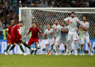 <p>Stepping up: Cristiano Ronaldo scores a stunning long-range free kick to complete his hat-trick for Portugal. (AP) </p>