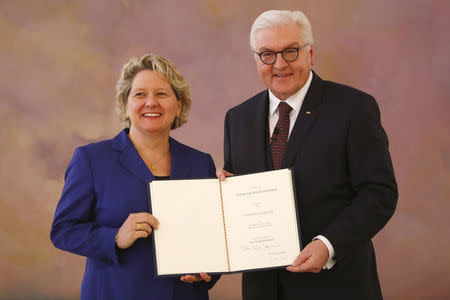 FILE PHOTO: German Environment Minister Svenja Schulze (L) receives her certificate of appointment from German President Frank-Walter Steinmeier during a ceremony at Bellevue Palace in Berlin, Germany, March 14, 2018. REUTERS/Fabrizio Bensch