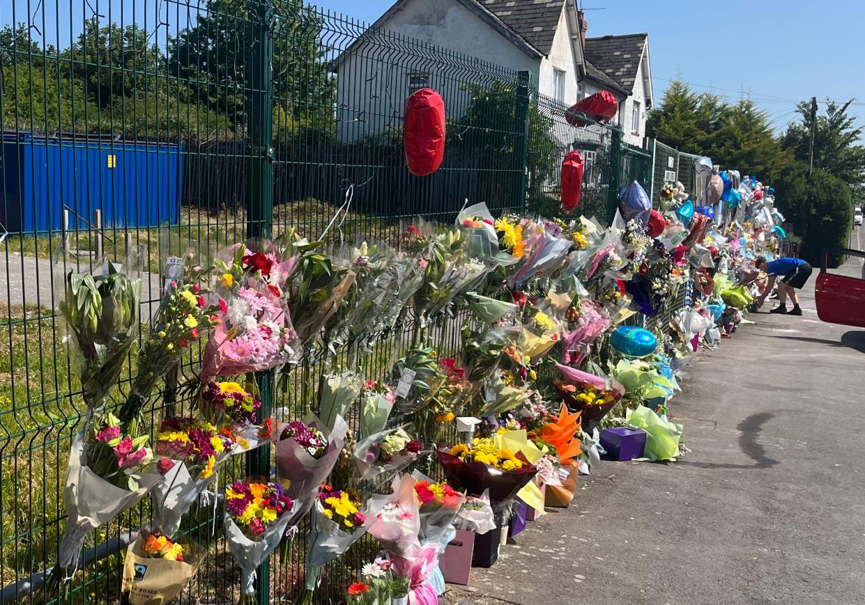 Floral tributes left to Kyrees Sullivan and Harvey Evans on Snowden Road, Ely, Cardiff (PA)